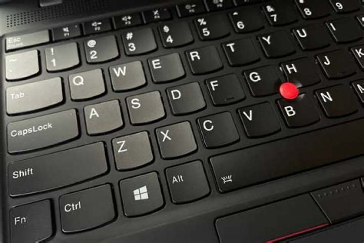How do I reinstall my Lenovo laptop keyboard?