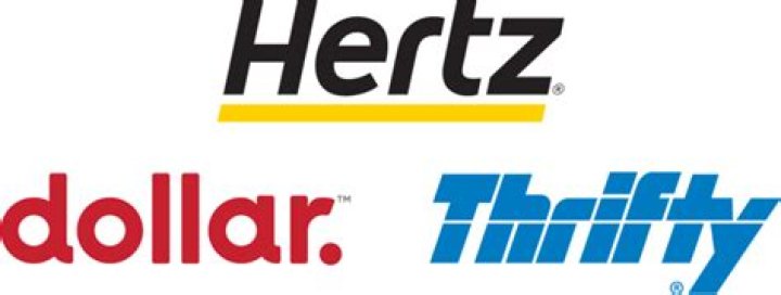 When did Hertz buy Dollar Thrifty?